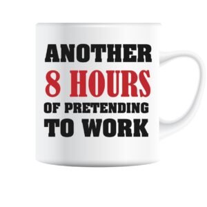 White mug printed with “Another 8 Hours of Pretending to Work” in bold black and red lettering