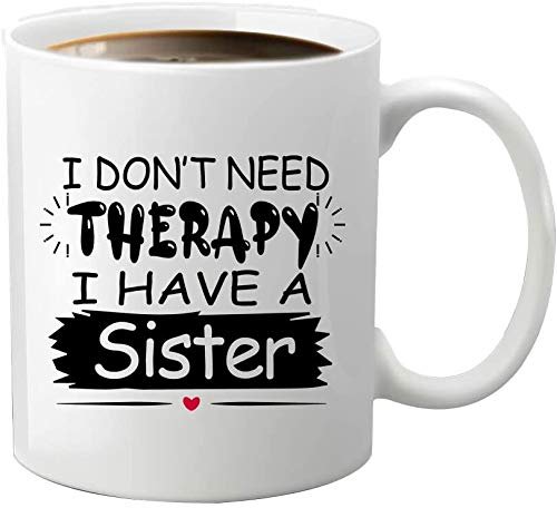 0f3f2d3b.jpg White mug printed with “I Don't Need Therapy, I Have a Sister” in bold black lettering