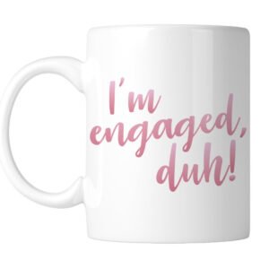 White mug with โI'm engaged, duh!โ in pink script, handle on the left