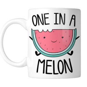 White mug with a smiling watermelon slice and “One in a Melon”, handle on the left