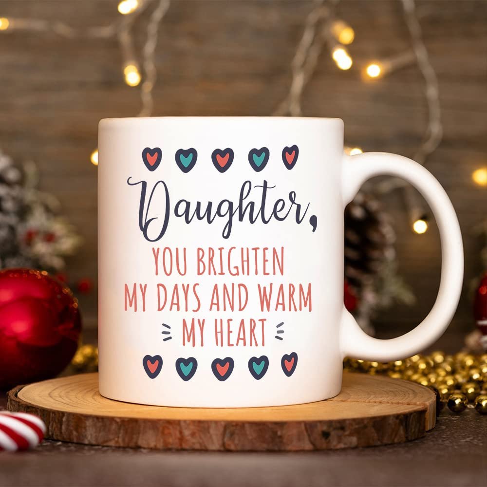 1c168678.jpg Daughter mug beside red baubles