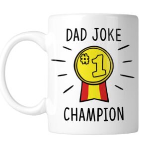 White mug with Dad Joke Champion and a gold No.1 medal, handle on the left