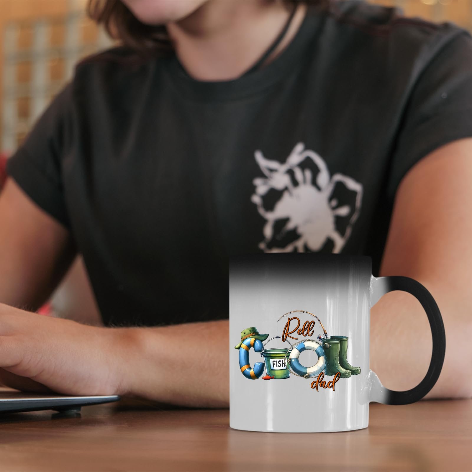 61bqo8xqlil.jpg Reel Cool Dad colour changing mug on a desk beside a laptop