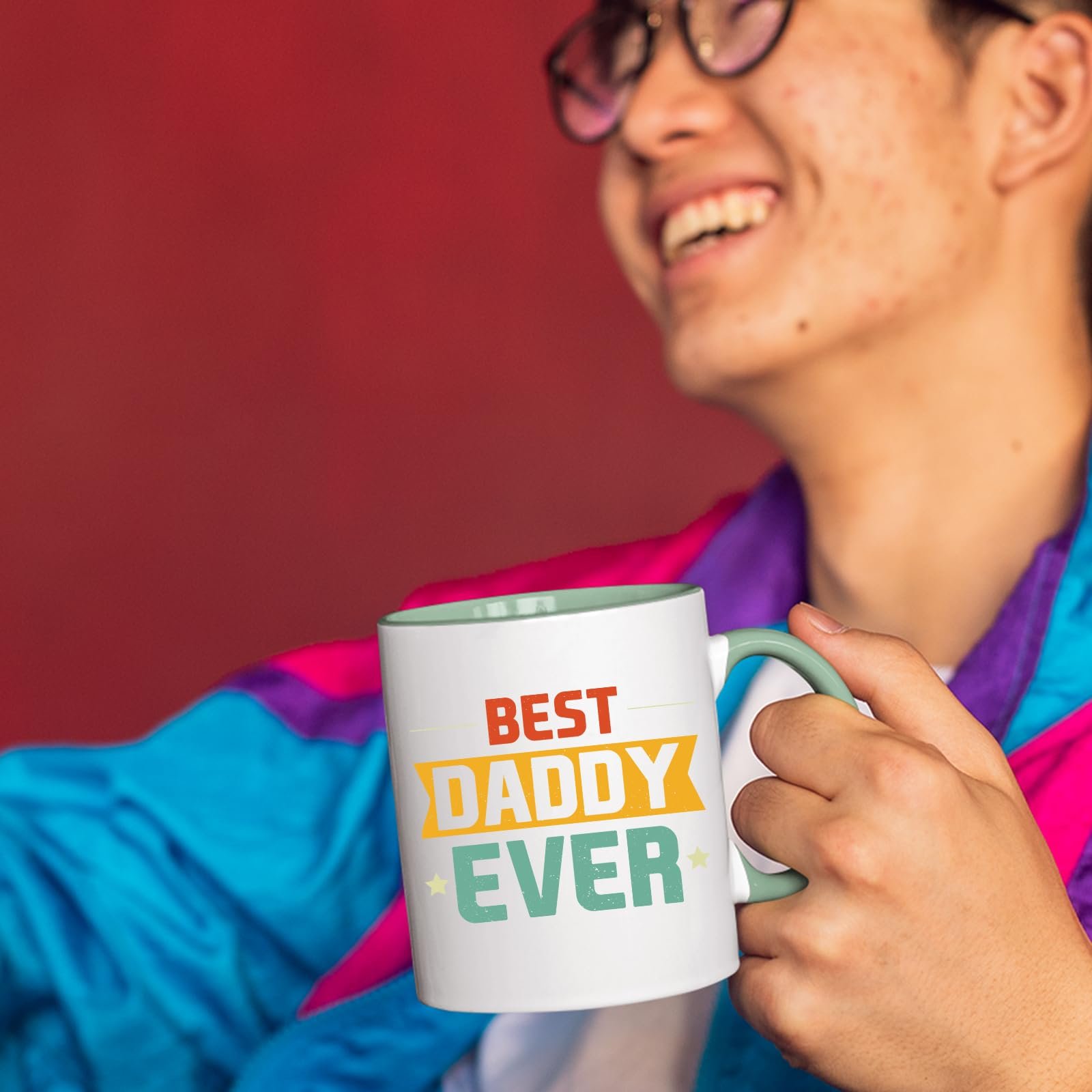61dkvxoebgl.jpg Smiling person in a colourful jacket holding the Best Daddy Ever retro mug with a light green handle