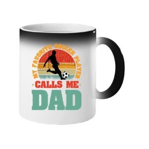 Colour changing mug revealing a footballer in silhouette on a retro sunset with “My favorite soccer player calls me Dad”