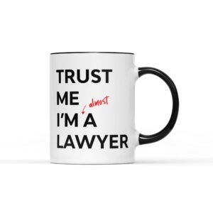 White mug with a black handle and “Trust me I'm almost a lawyer”