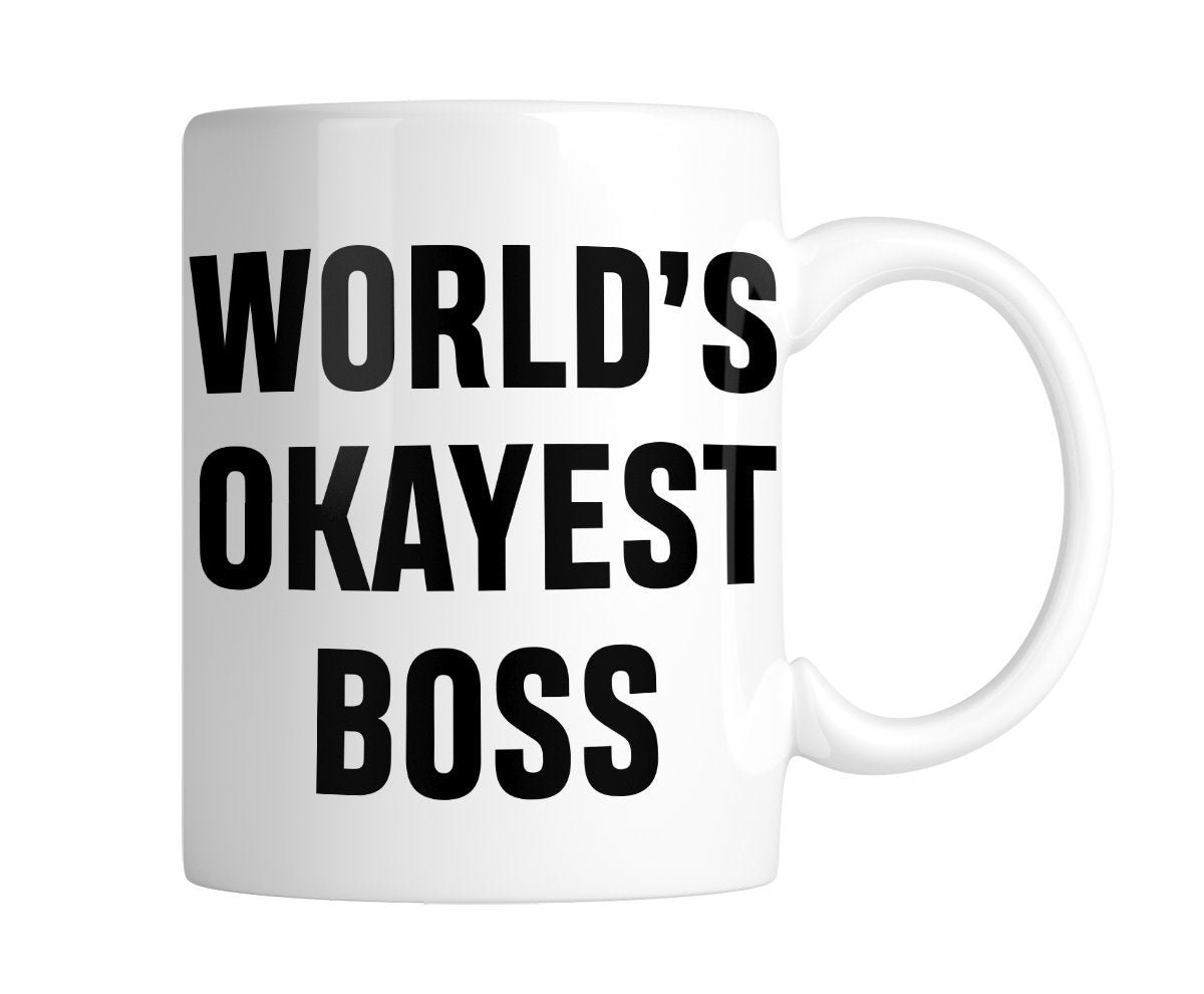 70139f03.jpg White mug with “World's Okayest Boss” in bold black lettering, handle on the right