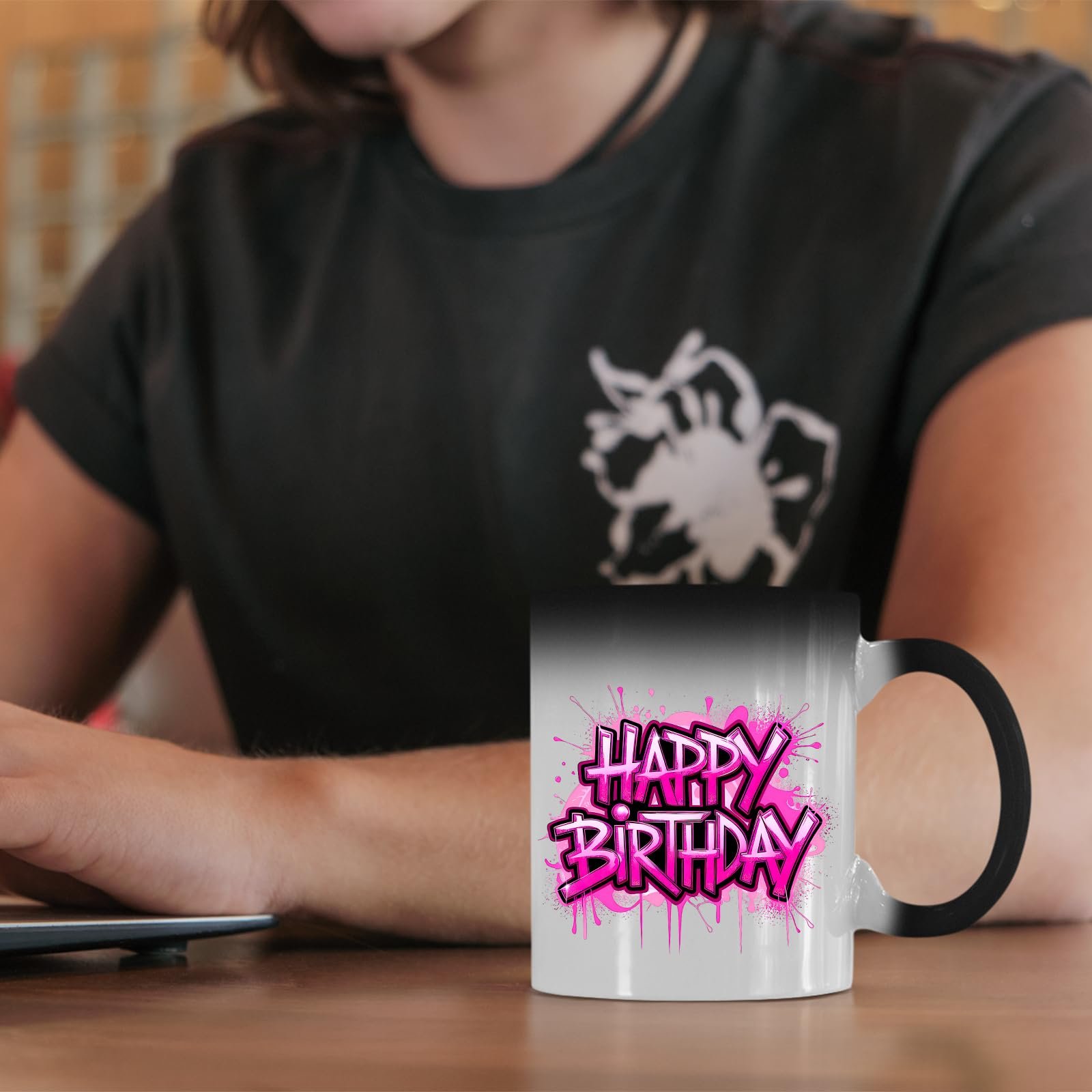 711qpbbnbll.jpg Happy Birthday pink drip colour changing mug on a desk beside a laptop