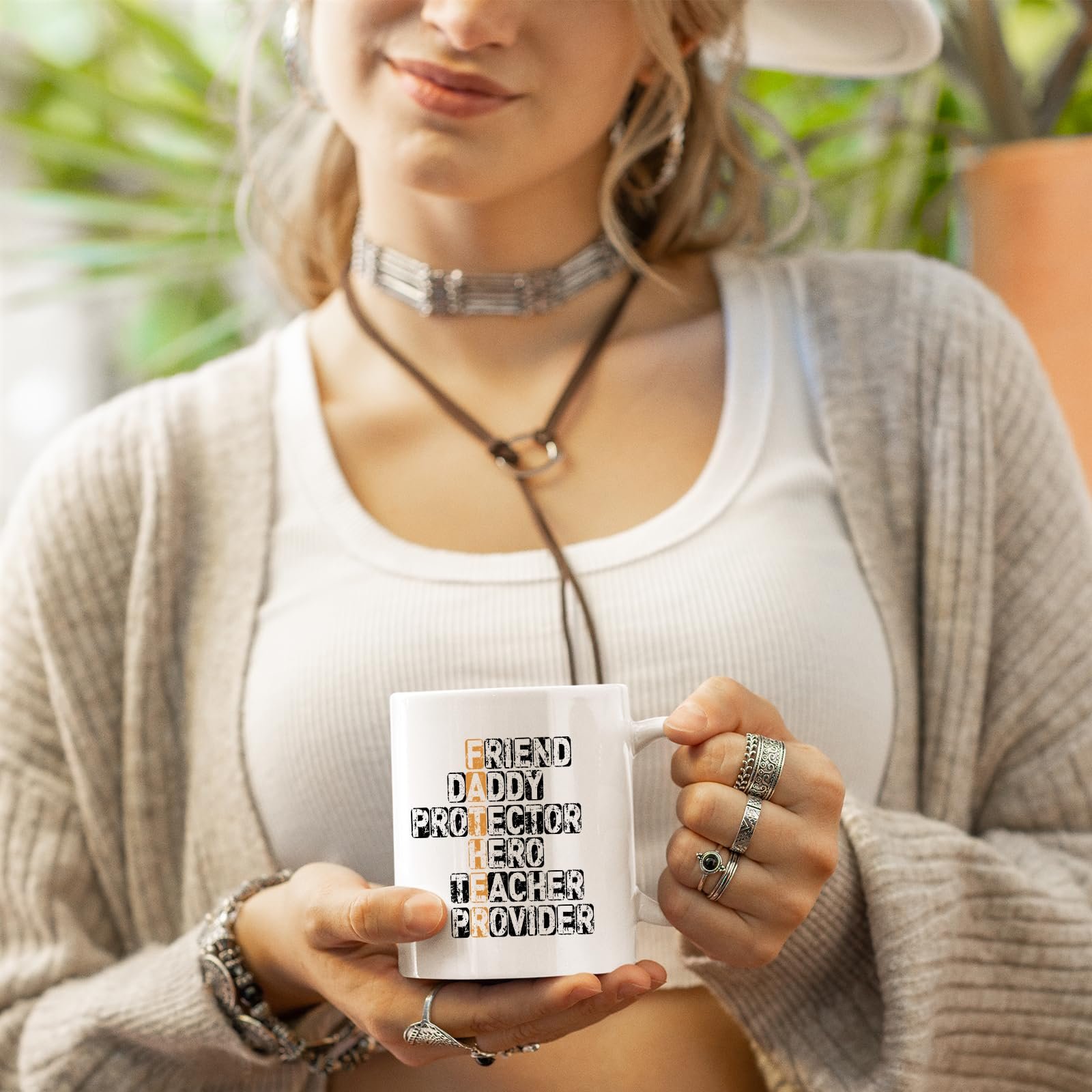 711 m7boe5l.jpg Woman in a cardigan holding the FATHER acrostic mug