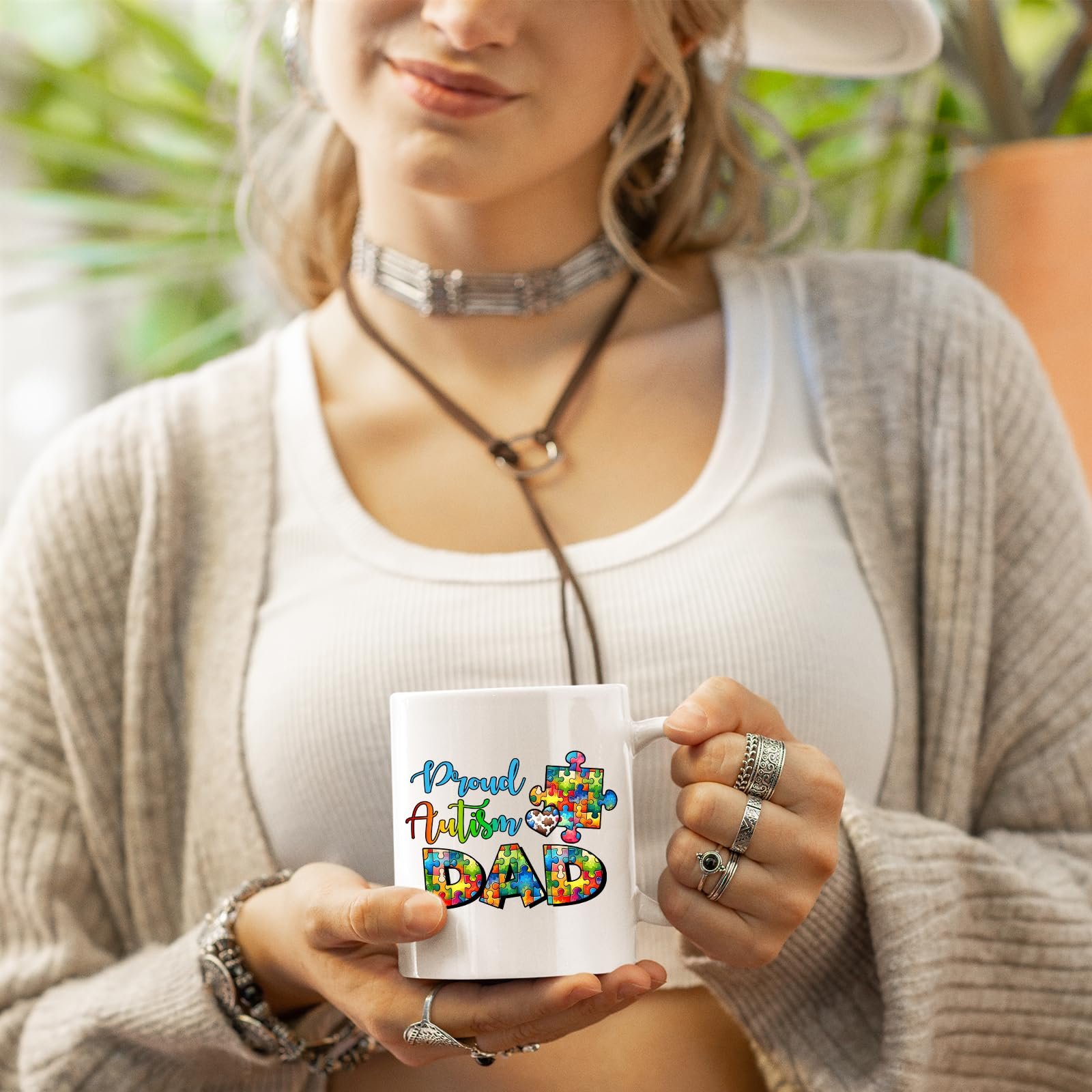 711nkhfjznl.jpg Woman in a cardigan holding the Proud Autism Dad mug