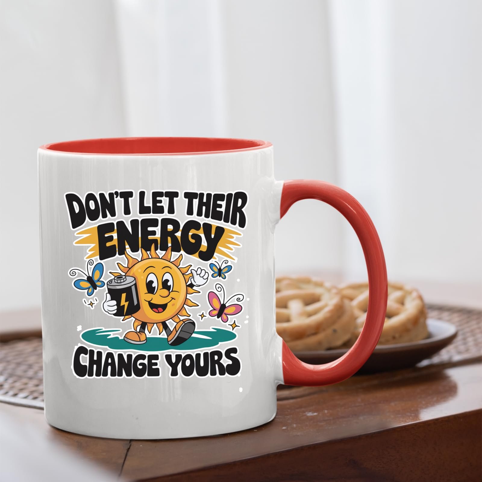 7167v6jtopl.jpg Positive Vibes sun mug with a red handle beside biscuits