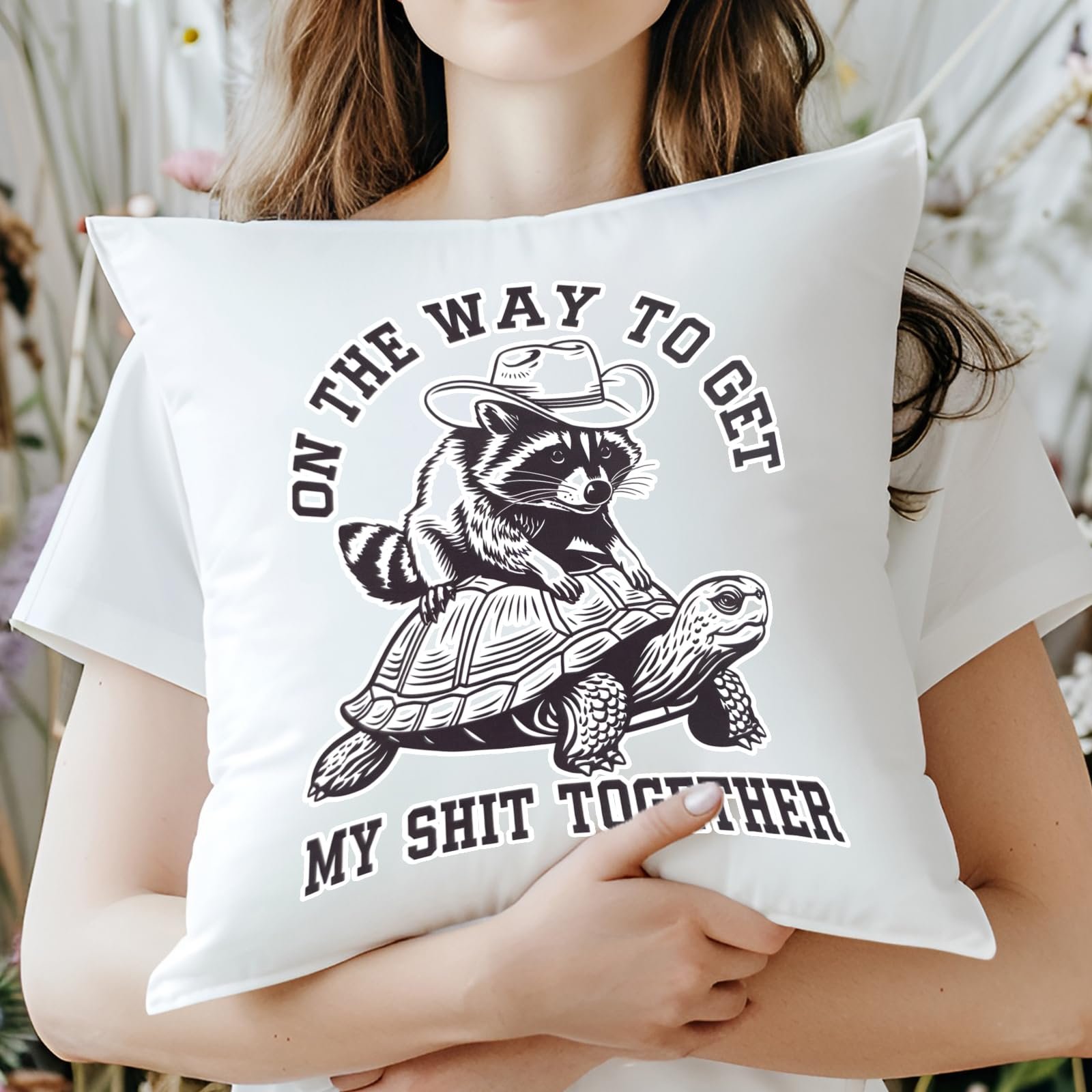 716ndimeibl.jpg Woman hugging the raccoon and tortoise cushion