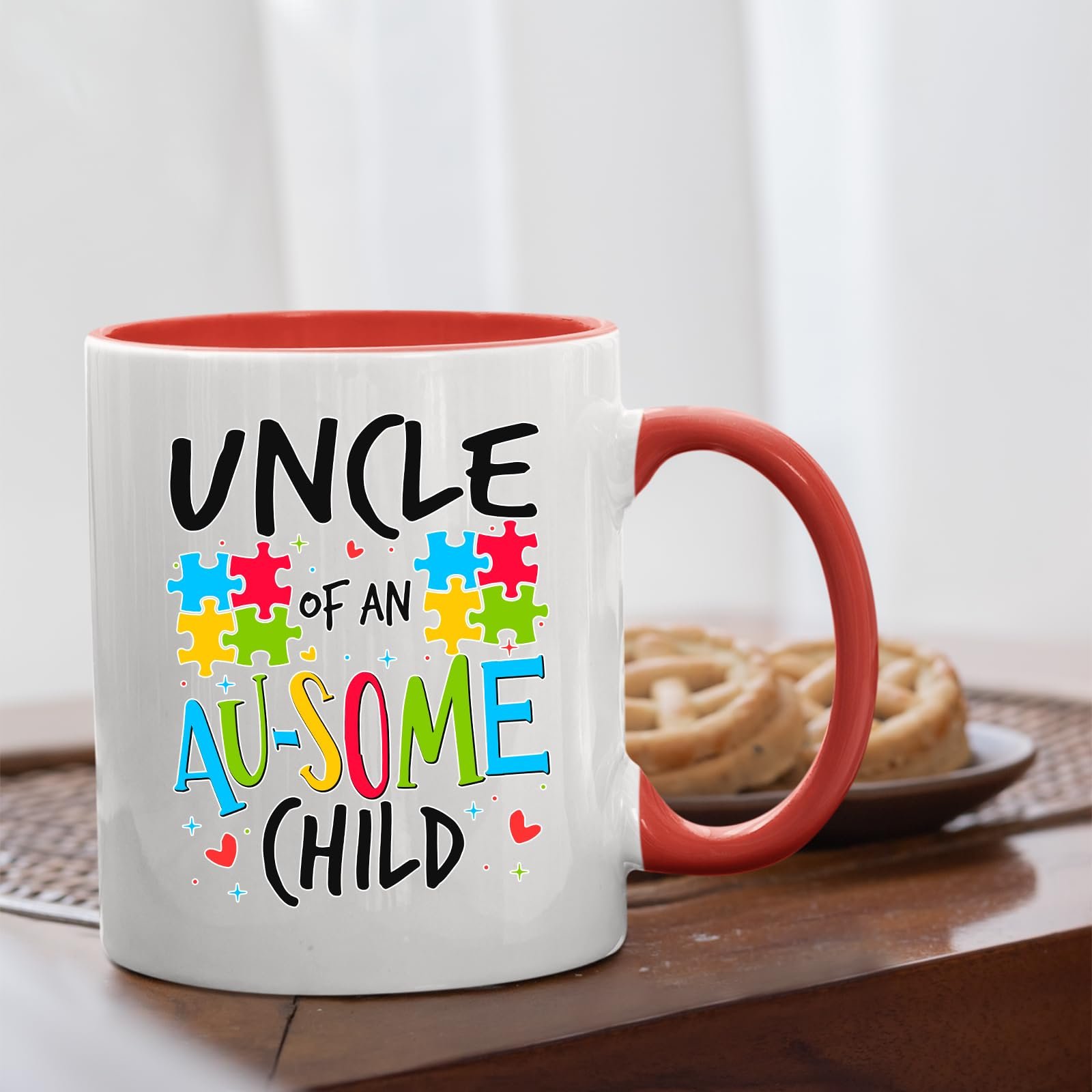 716wizigfpl.jpg Uncle of an Au-Some Child mug with a red handle beside biscuits