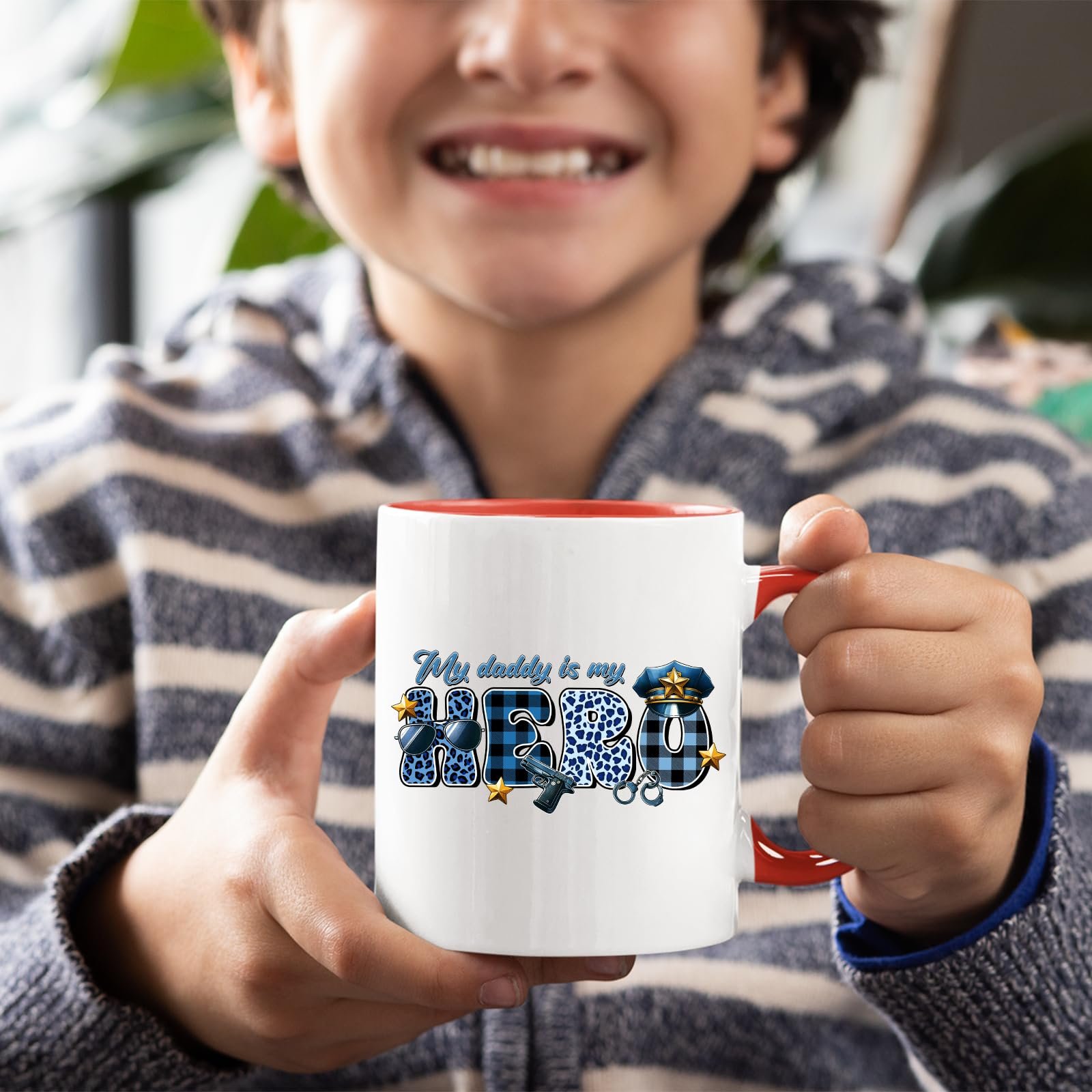 717bvnwewml.jpg Smiling child holding the My Daddy Is My Hero police mug with a red handle