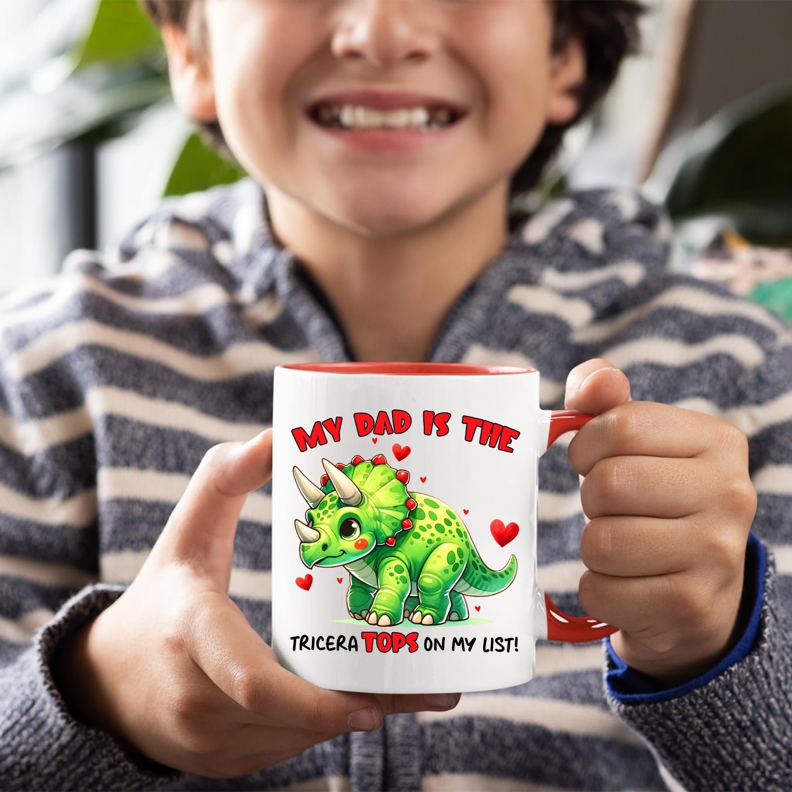 719i1p aexl.jpg Smiling child holding the Triceratops dad mug with a red handle