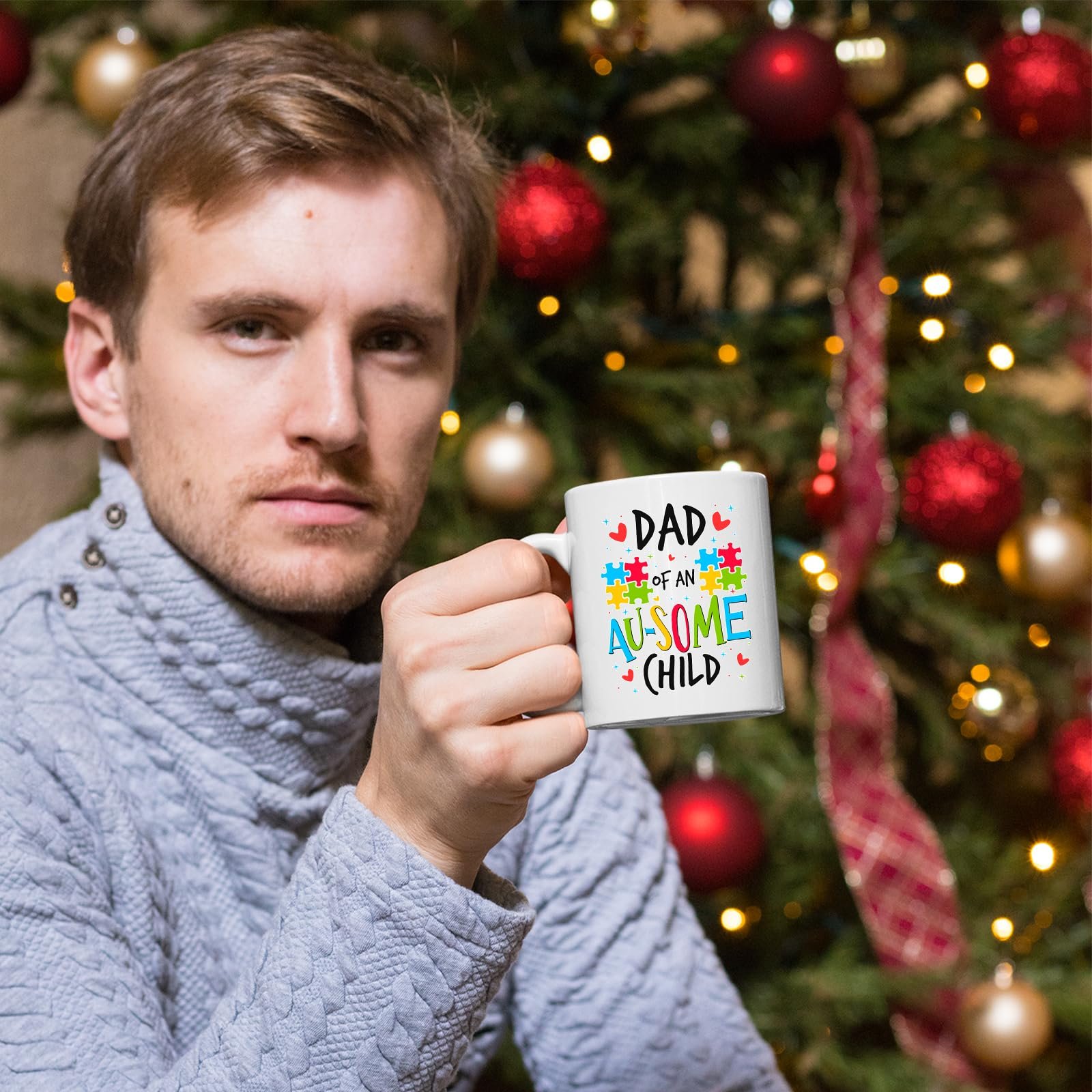 71e asazp2l.jpg Man holding the Dad of an Au-Some Child mug in front of a Christmas tree