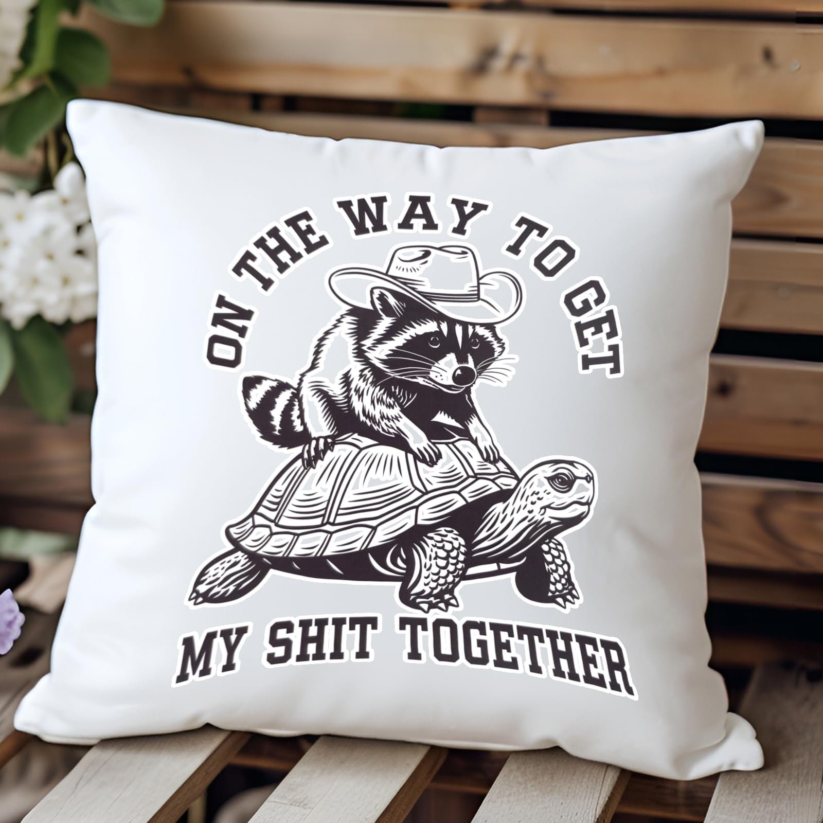 71jkzk7vrgl.jpg raccoon and tortoise cushion on a wooden bench