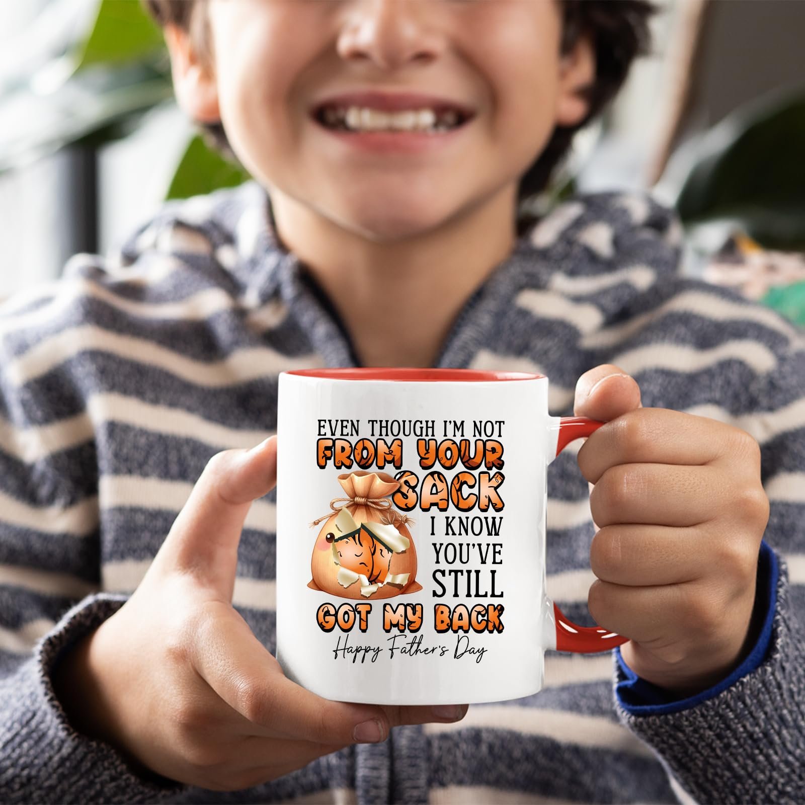 71lfkfkeksl.jpg Smiling child holding the Not From Your Sack mug with a red handle
