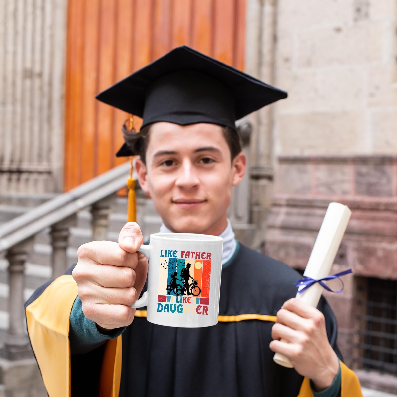 71lfu 8pbml.jpg Graduate in cap and gown holding the Like Father Like Daughter mug
