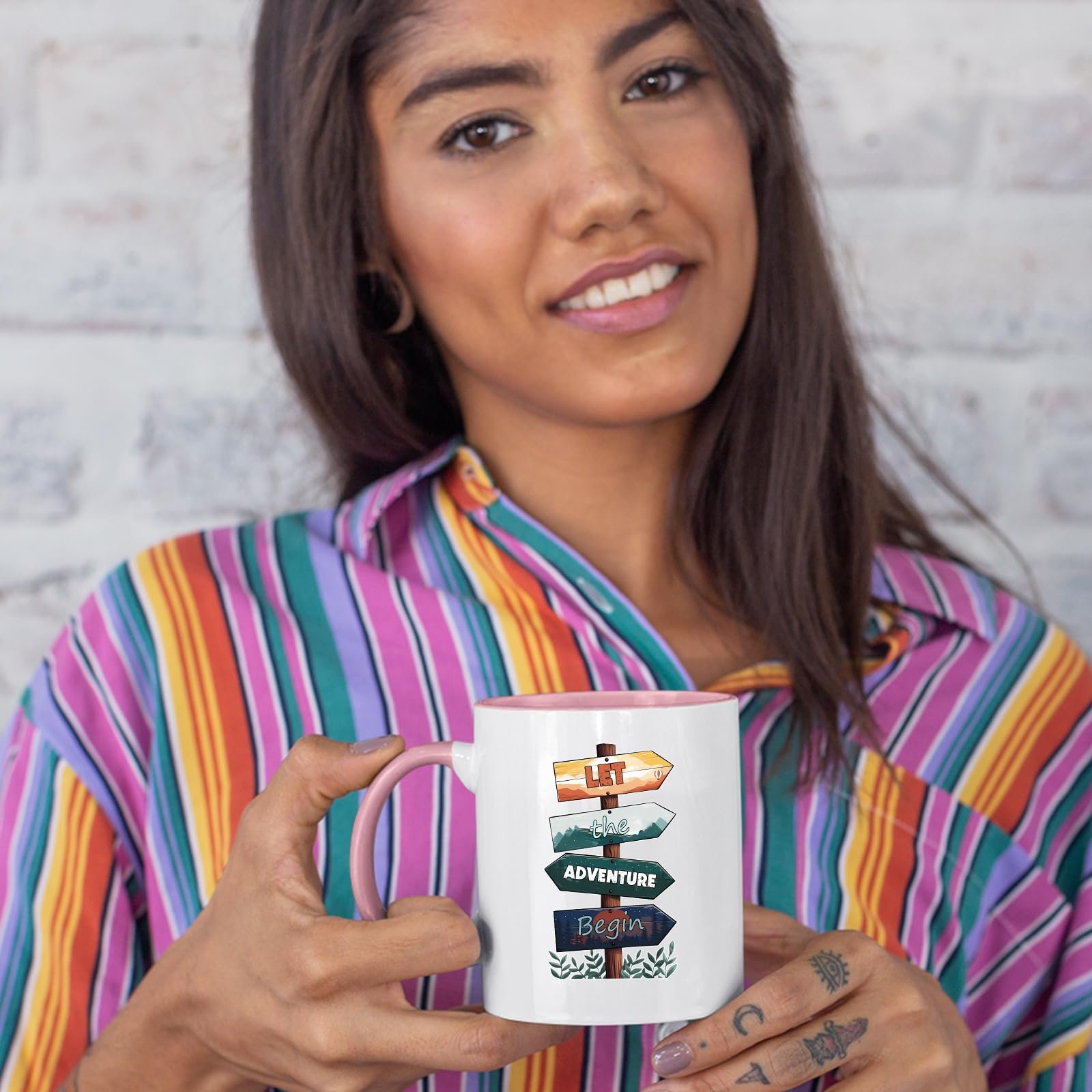 71srante11l.jpg Woman in a striped shirt holding the Let the Adventure Begin colour handle mug