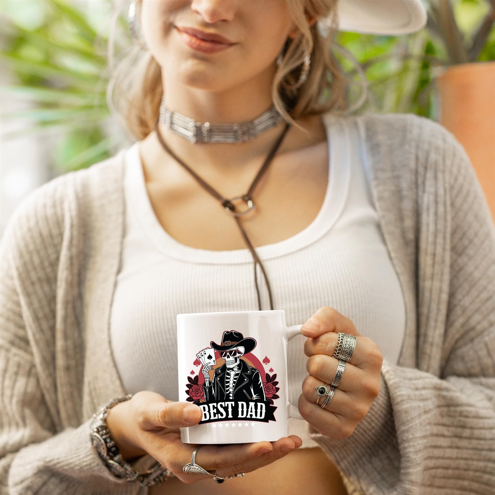 71vt1zgfdzl.jpg Woman in a cardigan holding the Best Dad skeleton cowboy mug