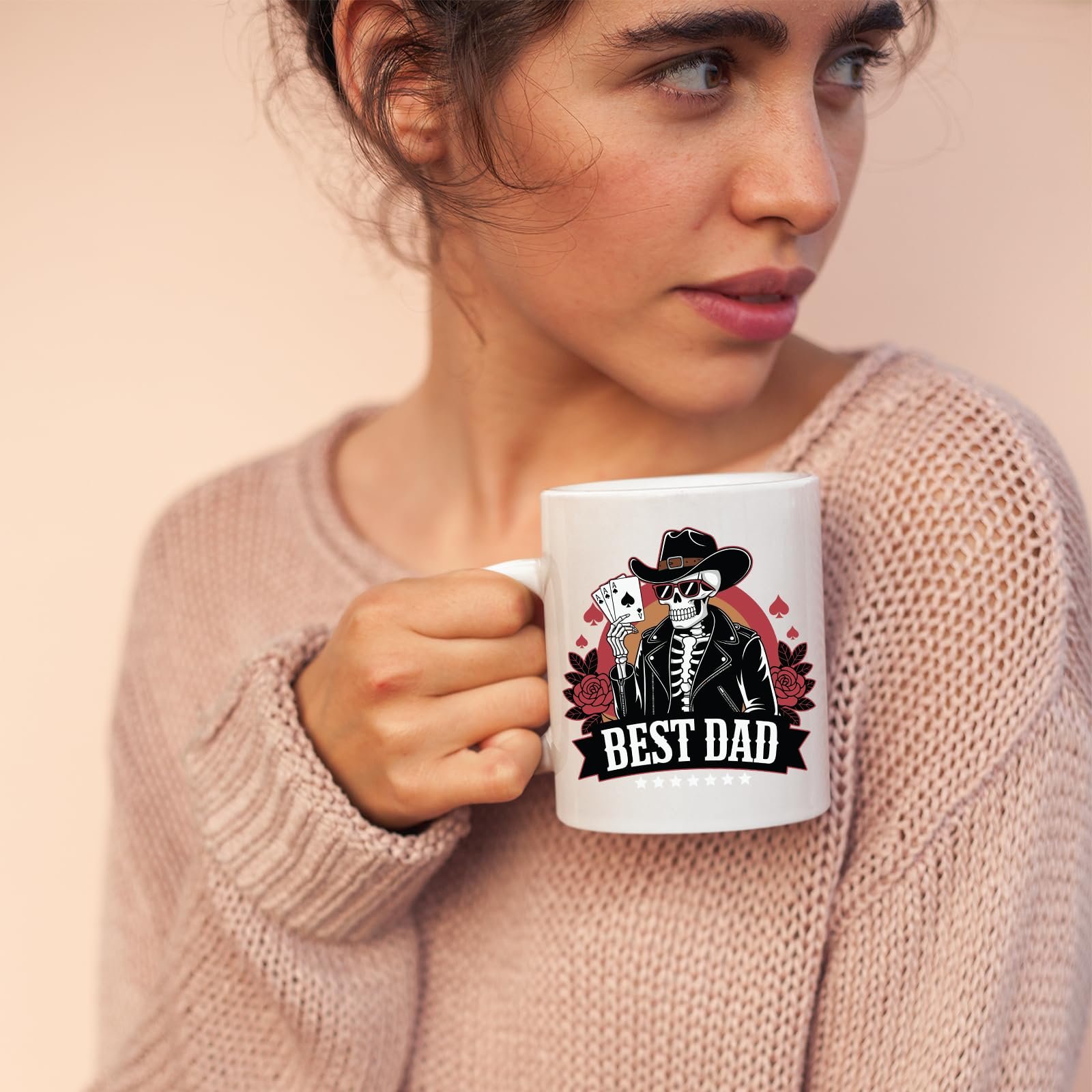 71ybkv09pil.jpg Woman in a pink jumper holding the Best Dad skeleton cowboy mug
