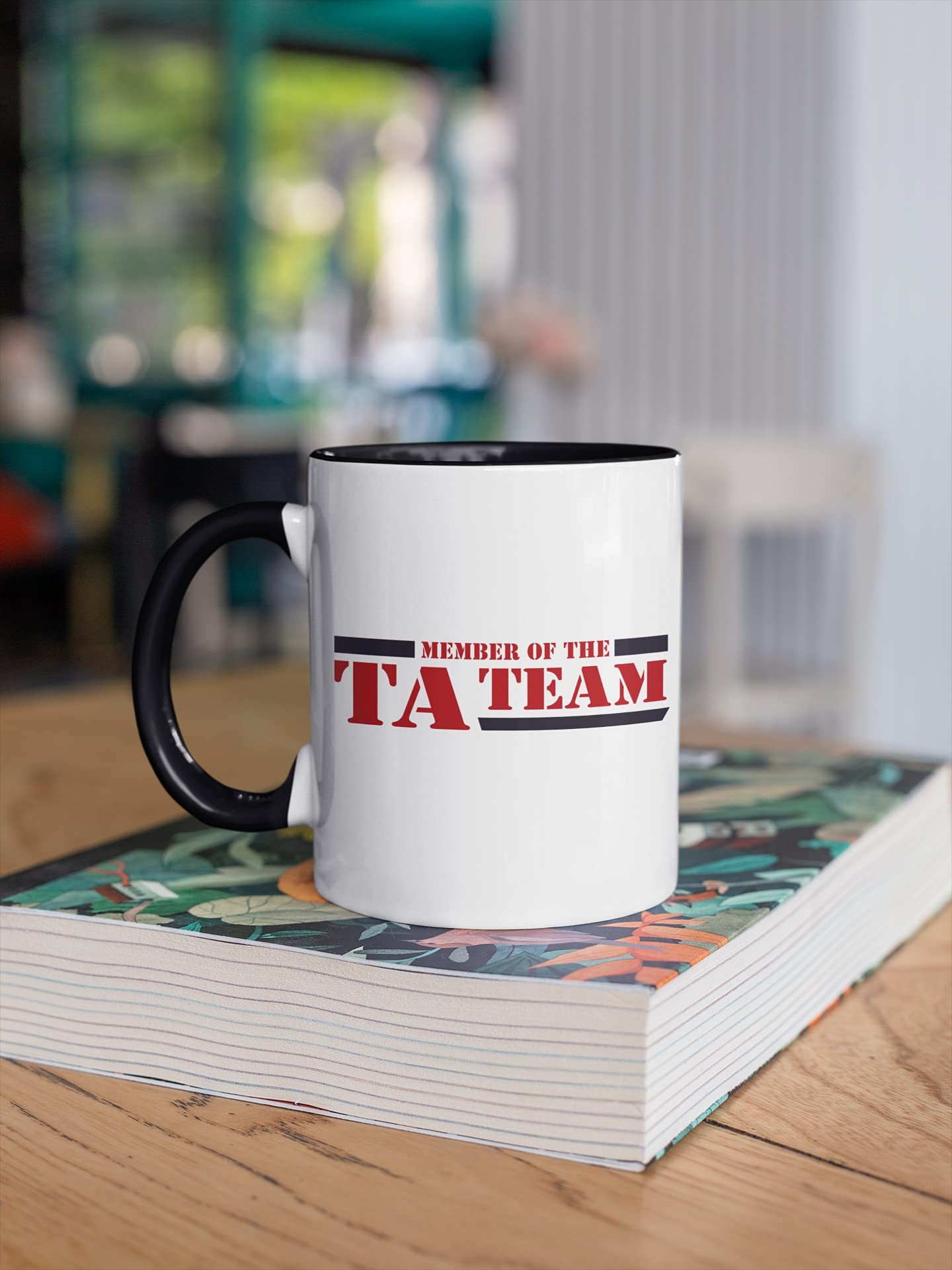 71bie15l81s.jpg TA Team mug on a stack of books