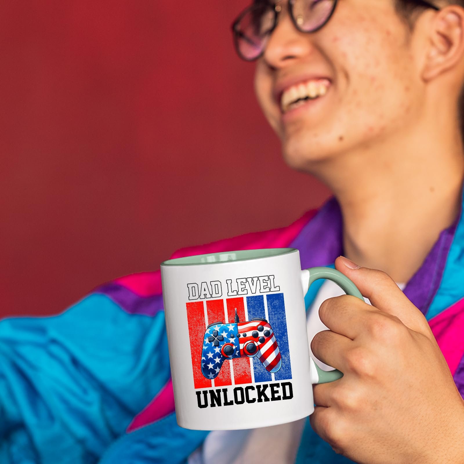71bq4lazrdl.jpg Smiling person in a colourful jacket holding the Dad Level Unlocked mug with a light green handle