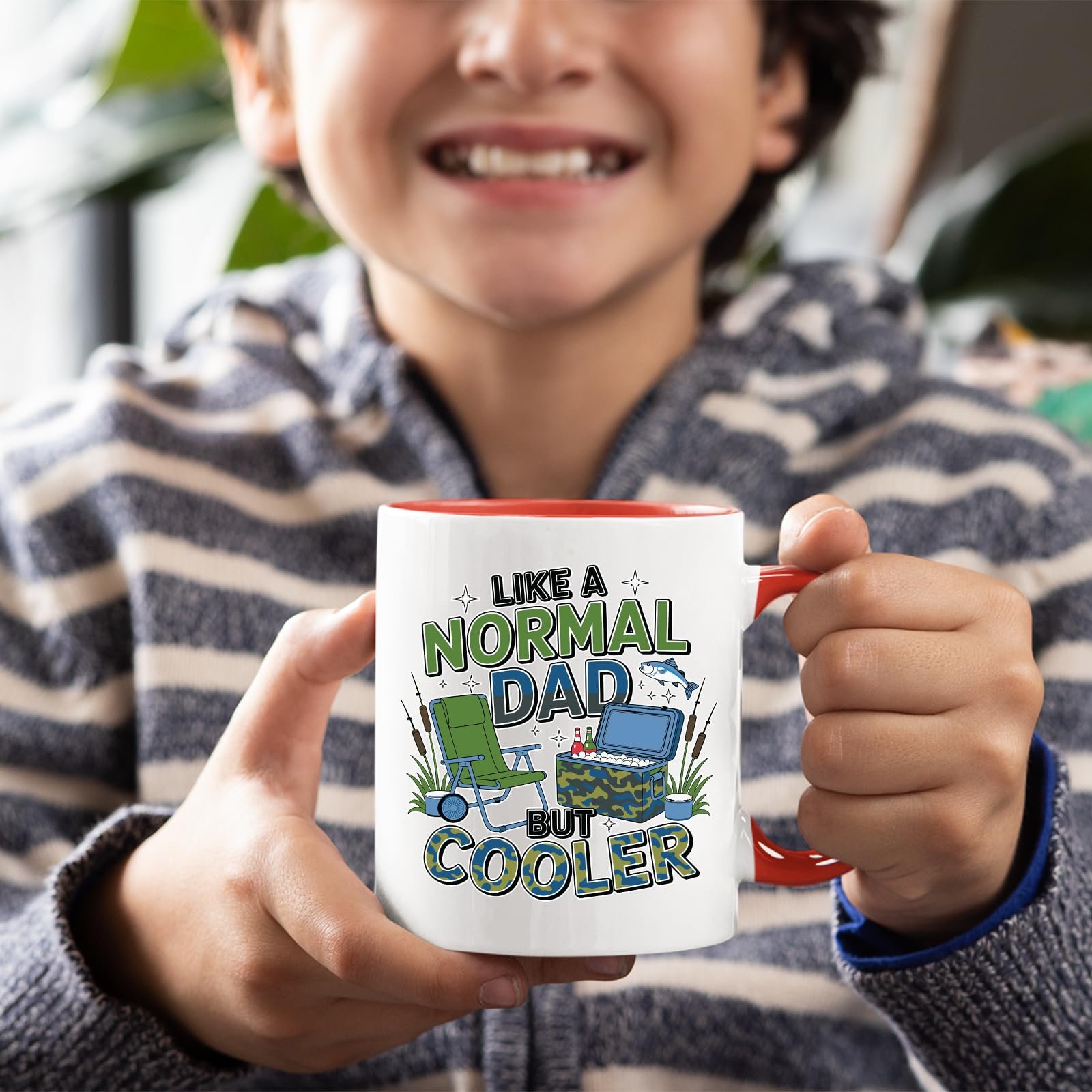 71ecm jijl.jpg Smiling child holding the Like a Normal Dad But Cooler mug with a red handle