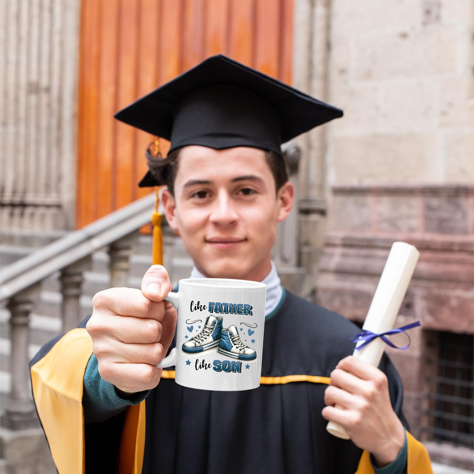 71jwetxjxel.jpg Graduate in cap and gown holding the Like Father Like Son mug
