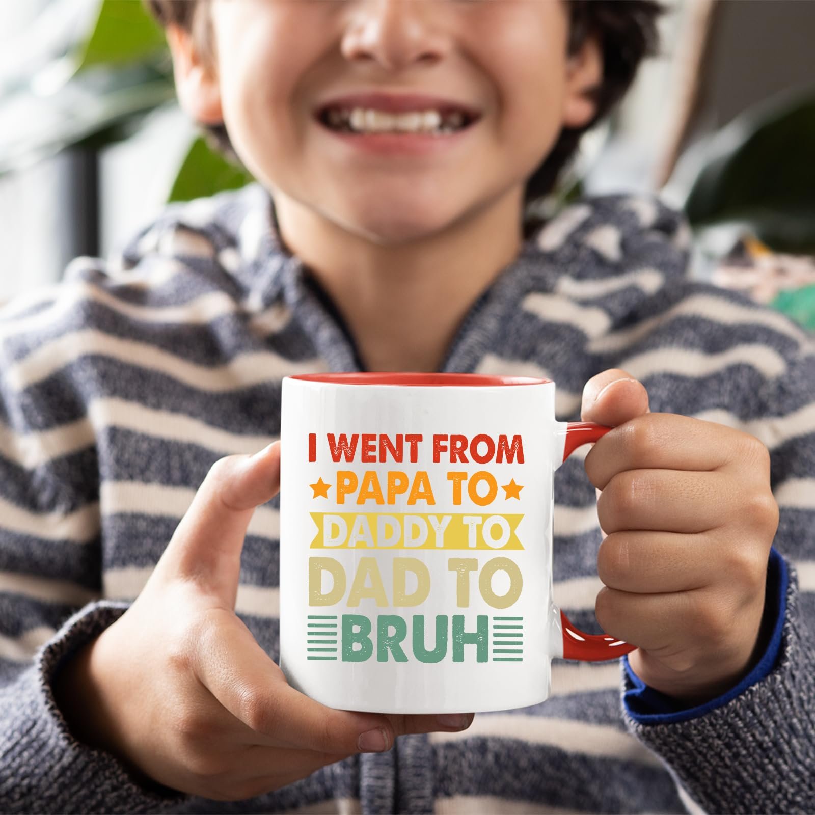 71jn90jqlql.jpg Smiling child holding the Papa to Bruh mug with a red handle