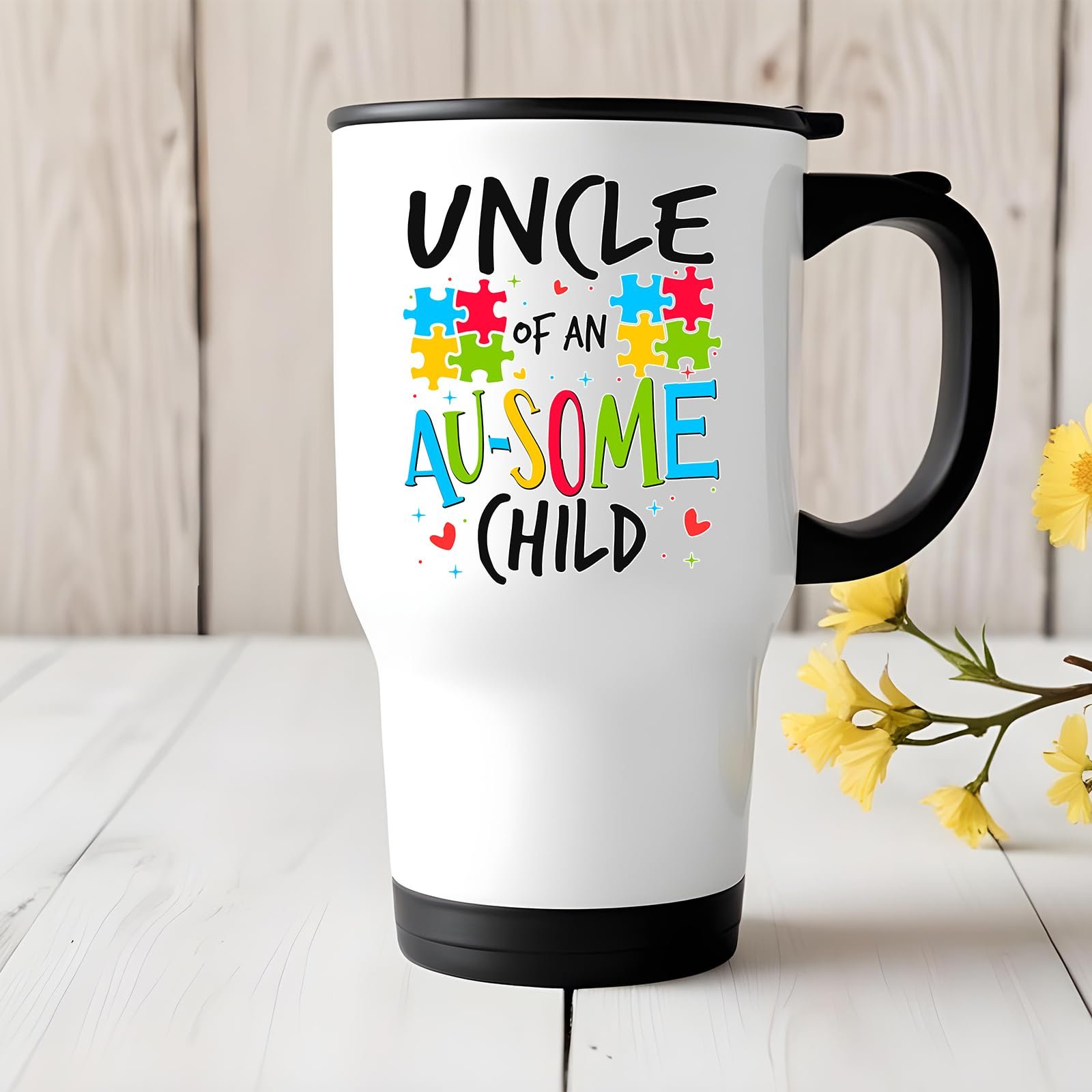 71jy8gvumfl.jpg Uncle of an Au-Some Child travel mug on a white wooden table with yellow flowers