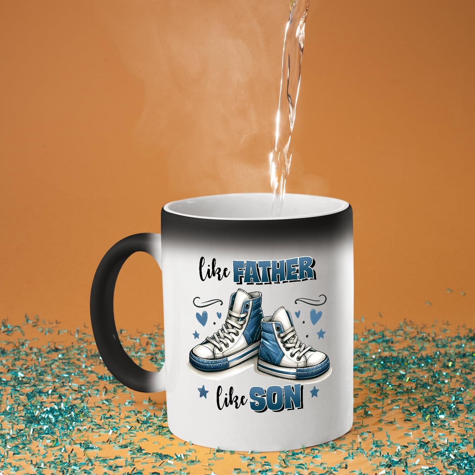 71nmdsrizyl.jpg Hot water poured into the Like Father Like Son colour changing mug as the design appears