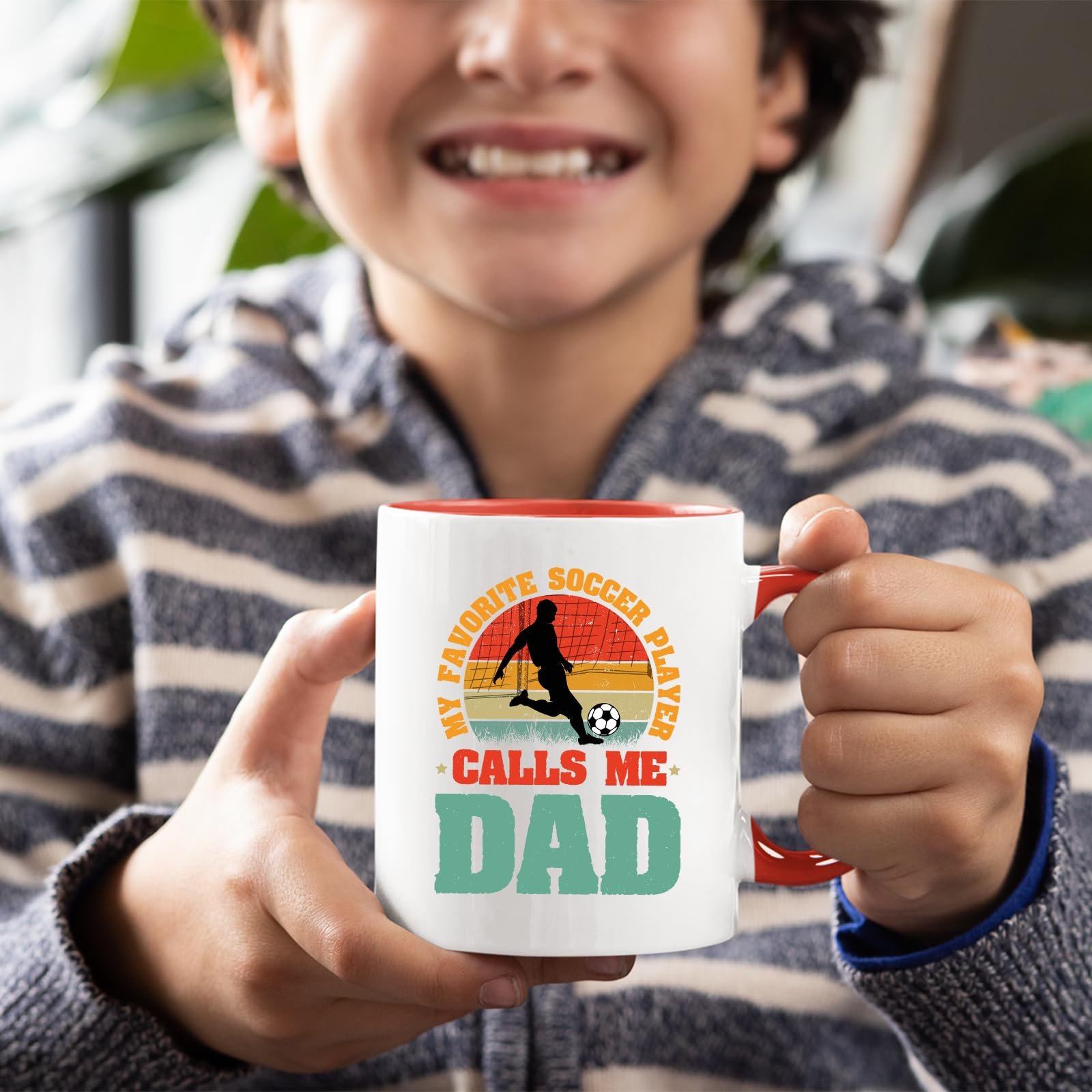 71qtqtd 05l.jpg Smiling child holding the Soccer Dad mug with a red handle
