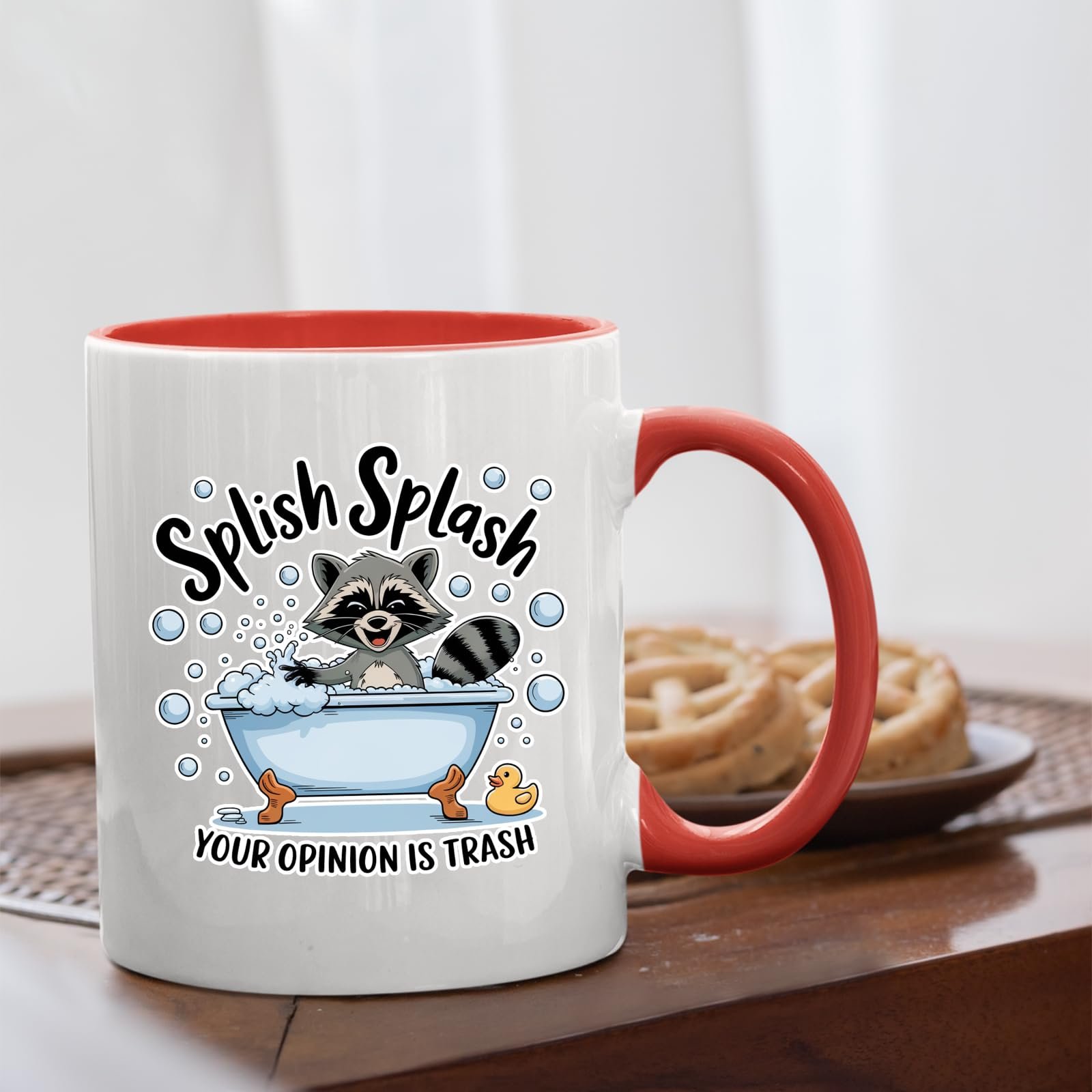 71rorq bxvl.jpg Splish Splash raccoon mug with a red handle beside biscuits