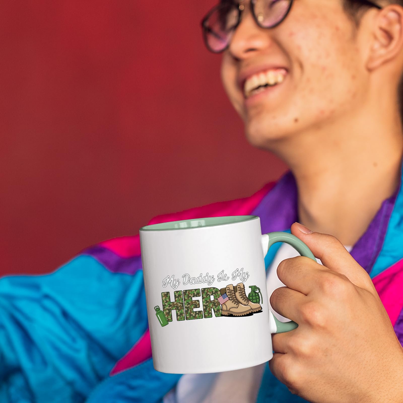 71rleqcjrql.jpg Smiling person in a colourful jacket holding the My Daddy Is My Hero military mug with a light green handle