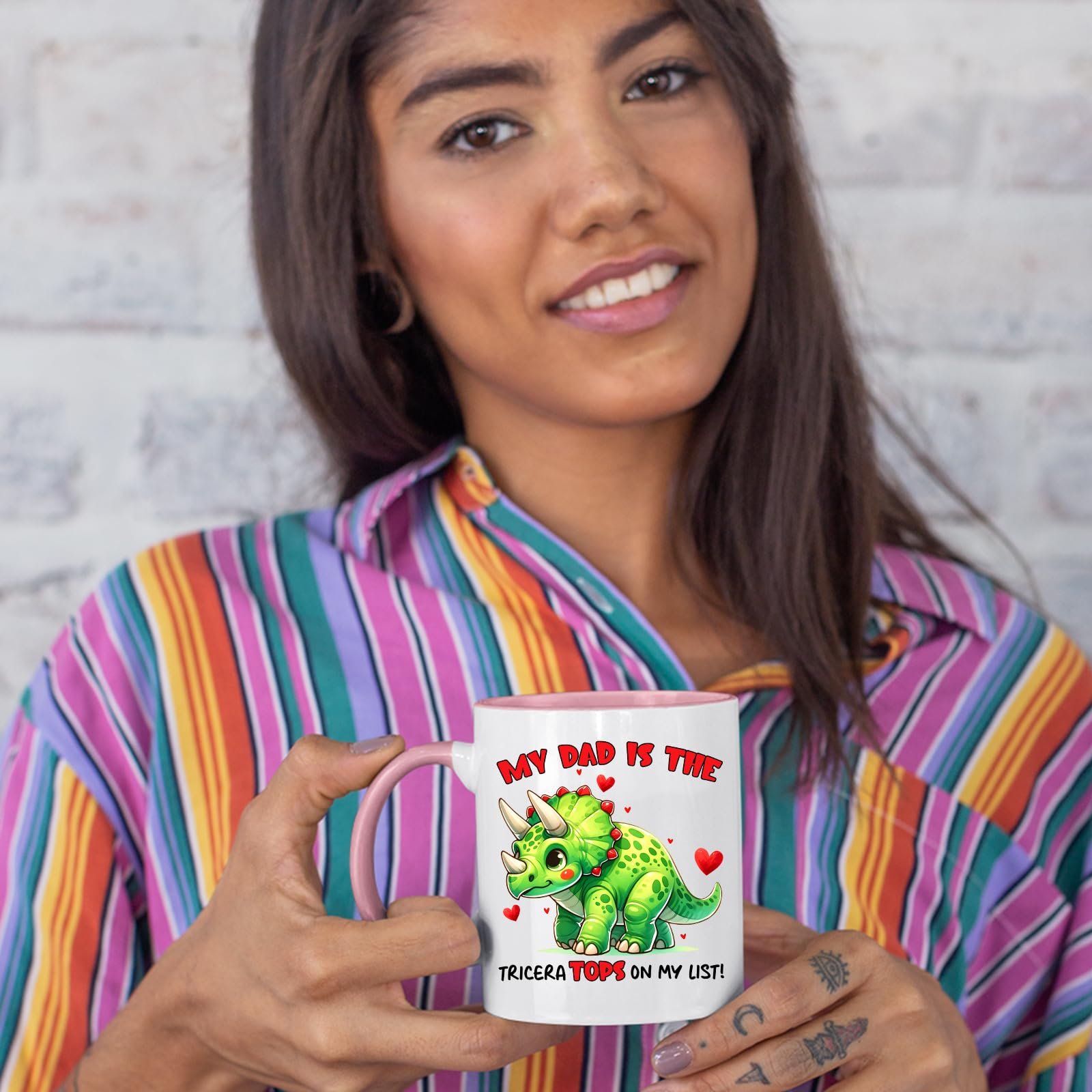 71tg64kqe7l.jpg Woman in a striped shirt holding the Triceratops dad colour handle mug