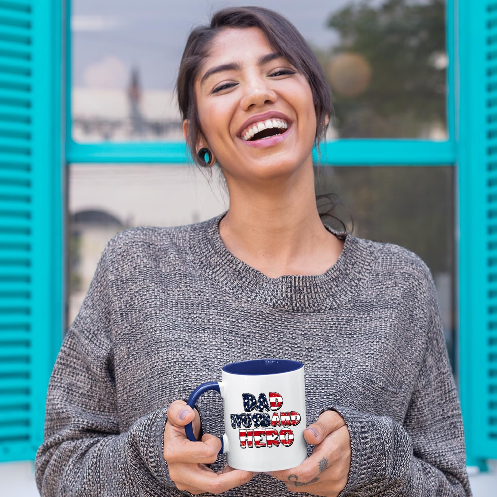 8162fuvpm5l.jpg Laughing woman holding the Dad Husband Hero mug with a dark blue handle