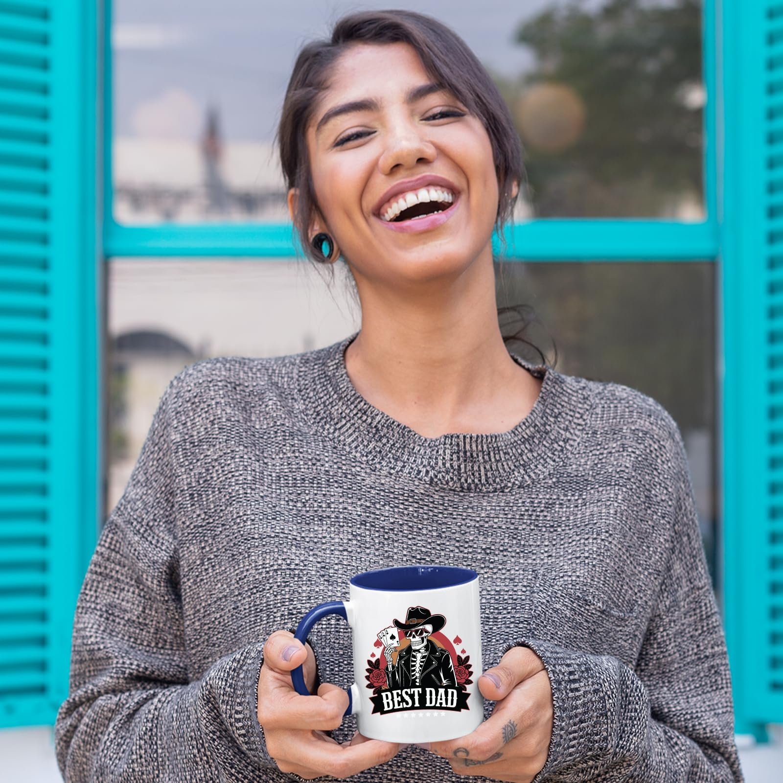 81a0ayqiwsl.jpg Laughing woman holding the Best Dad skeleton cowboy mug with a dark blue handle