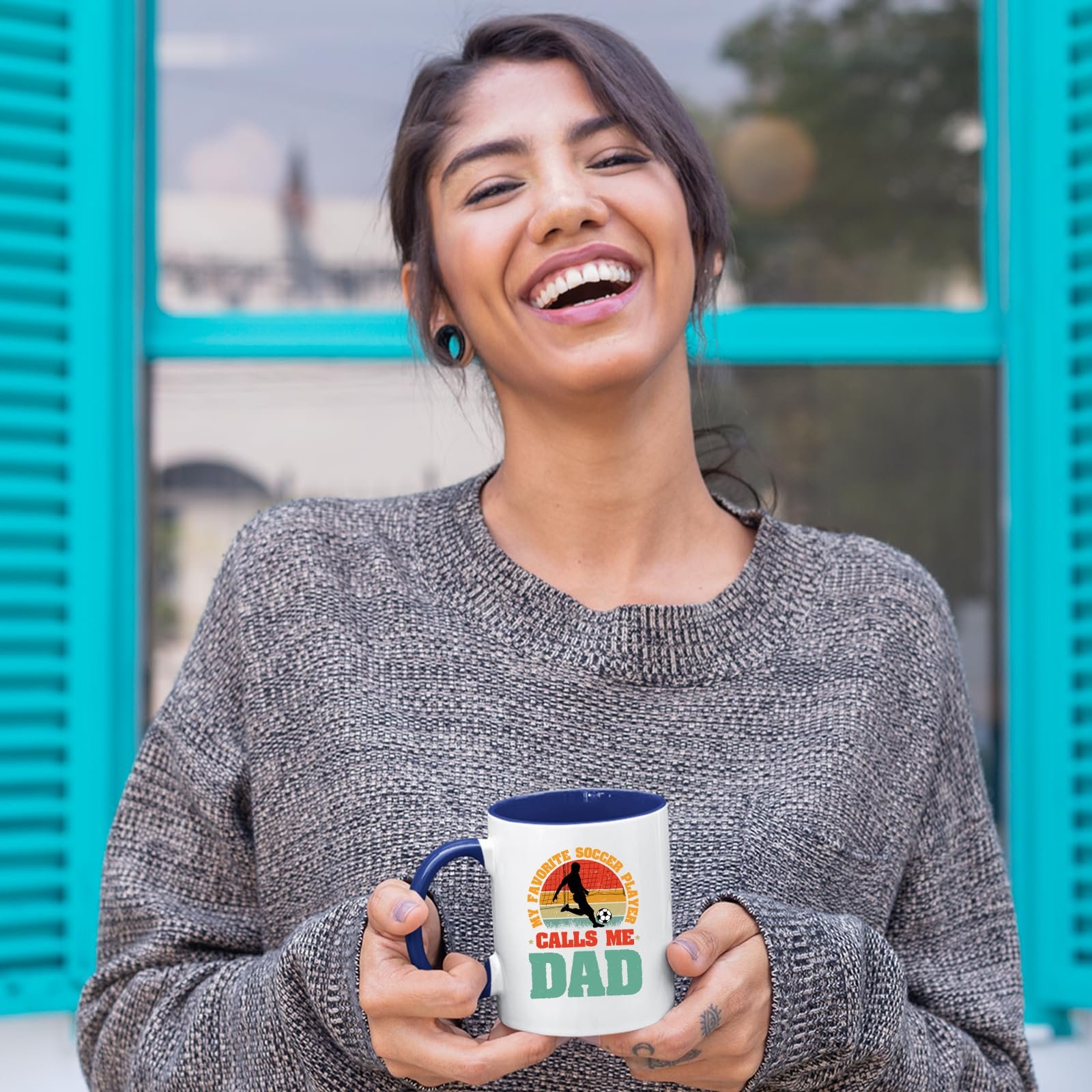81ddxco30fl.jpg Laughing woman holding the Soccer Dad mug with a dark blue handle