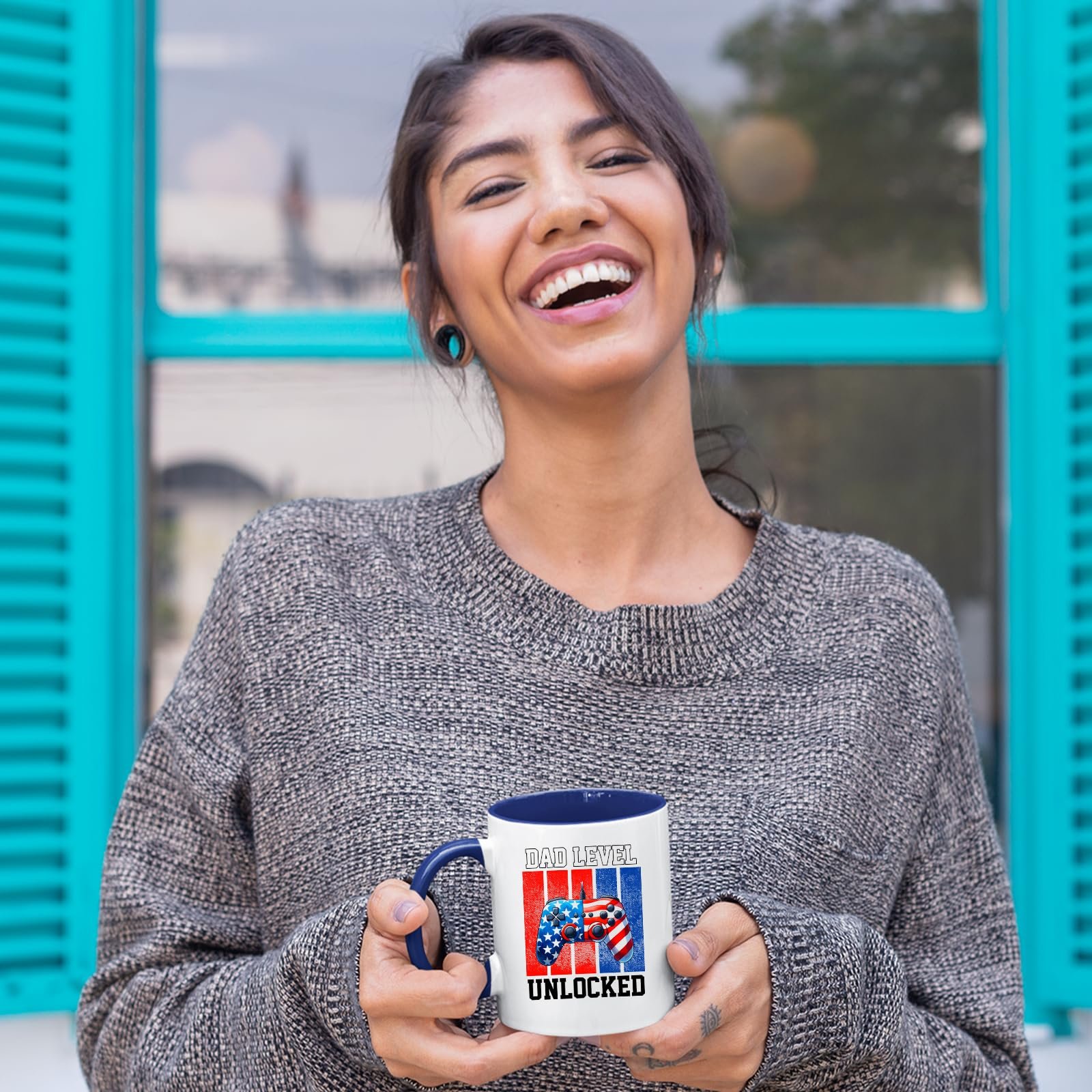 81 fgvbrwhl.jpg Laughing woman holding the Dad Level Unlocked mug with a dark blue handle