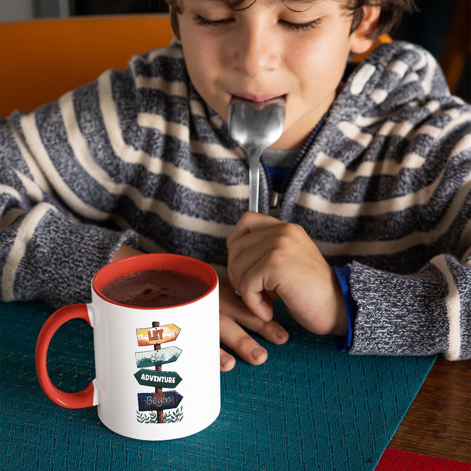 81ctzs3luml.jpg Child with a spoon next to the Let the Adventure Begin mug with a red handle