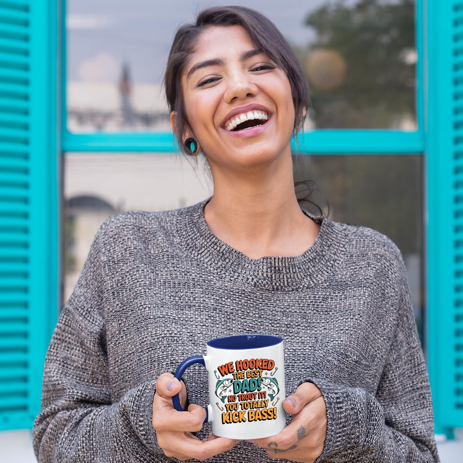 81elachdoql.jpg Laughing woman holding the We Hooked the Best Dad mug with a dark blue handle
