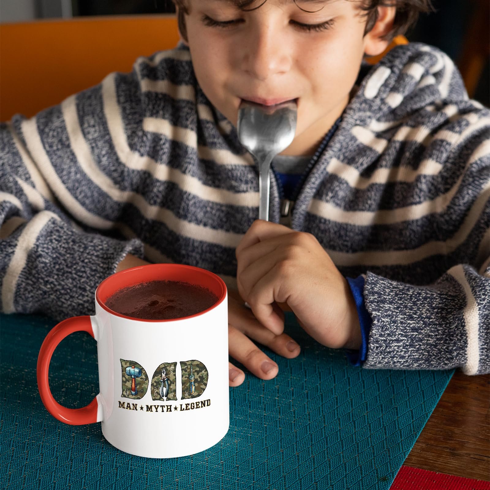 81otilka fl.jpg Child with a spoon next to the Dad Man Myth Legend tools mug with a red handle