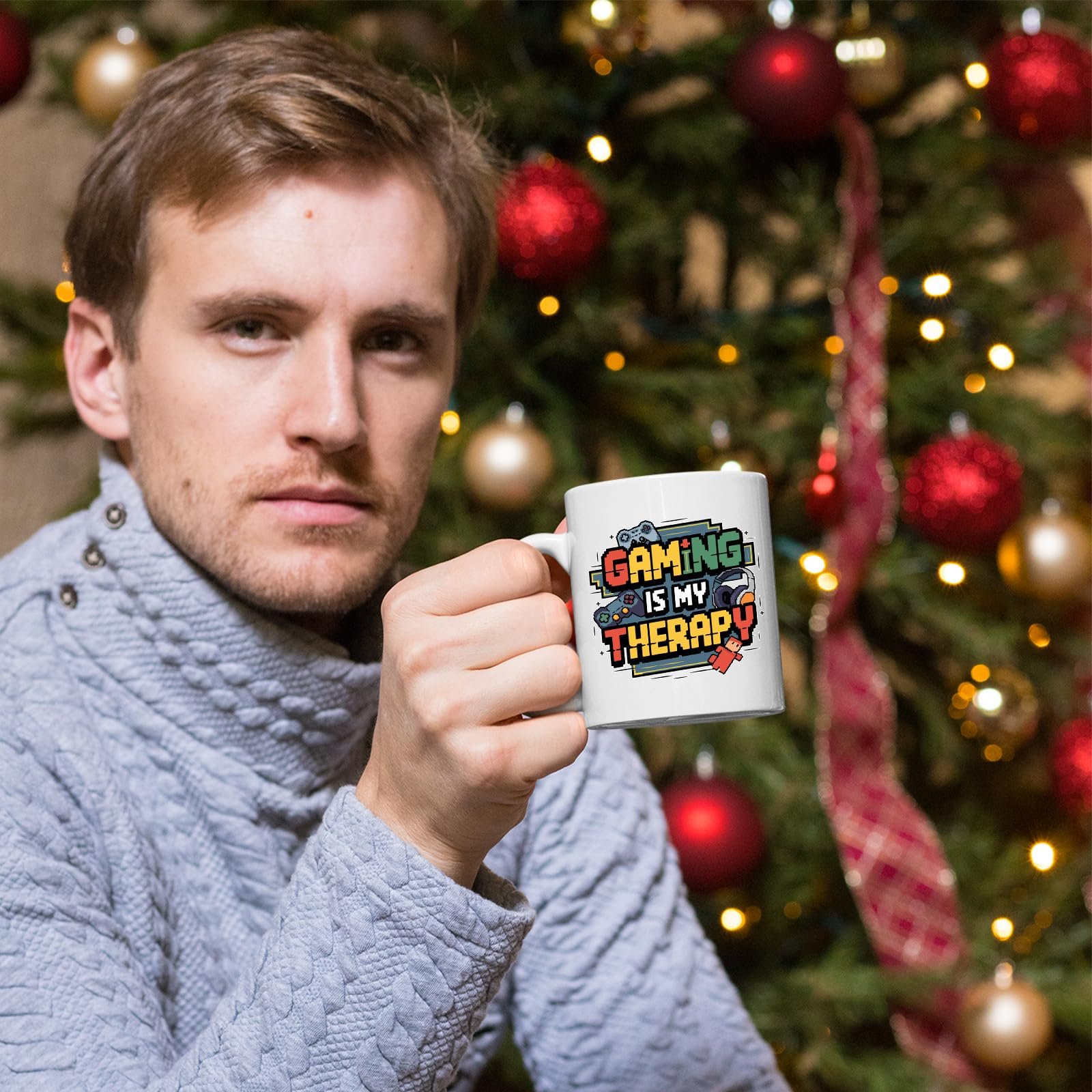 8c98a731.jpg Man holding the Gaming Is My Therapy mug by a Christmas tree