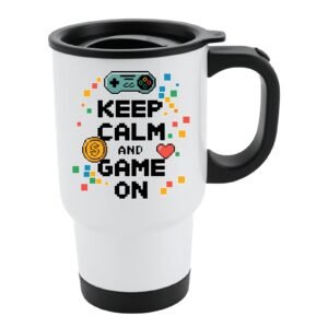 White travel mug with black lid and a โKeep Calm and Game Onโ design with a game controller