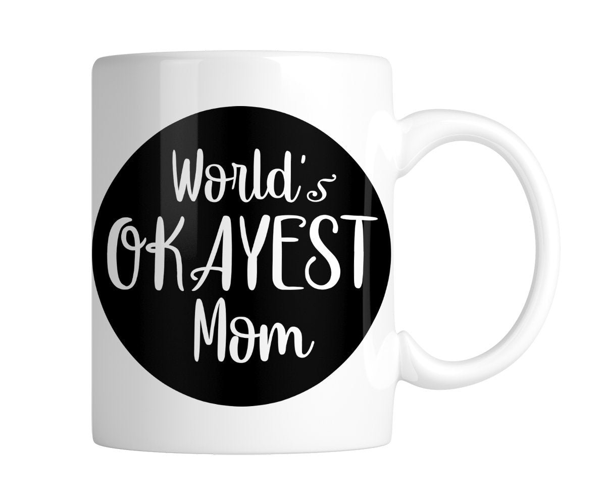 cbf2ff64.jpg White mug with “World's Okayest Mom” in white on a black circle, handle on the right